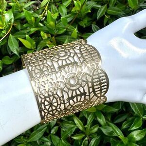 Gold tone laser cut out wide cuff bracelet
